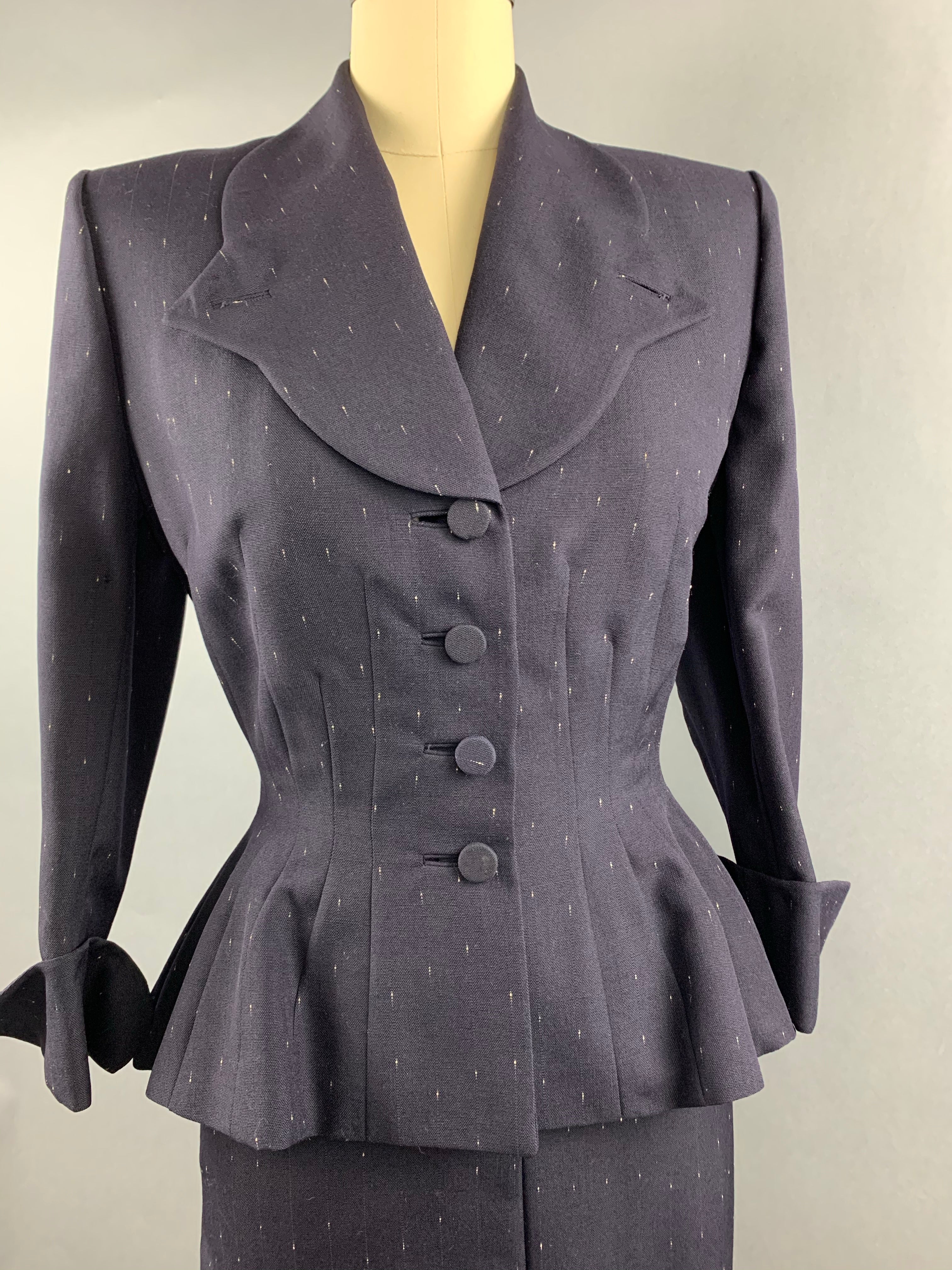 Late 1940s early 1950s Navy Blue with White Fleck Lilli Ann Peplum Suit Size M