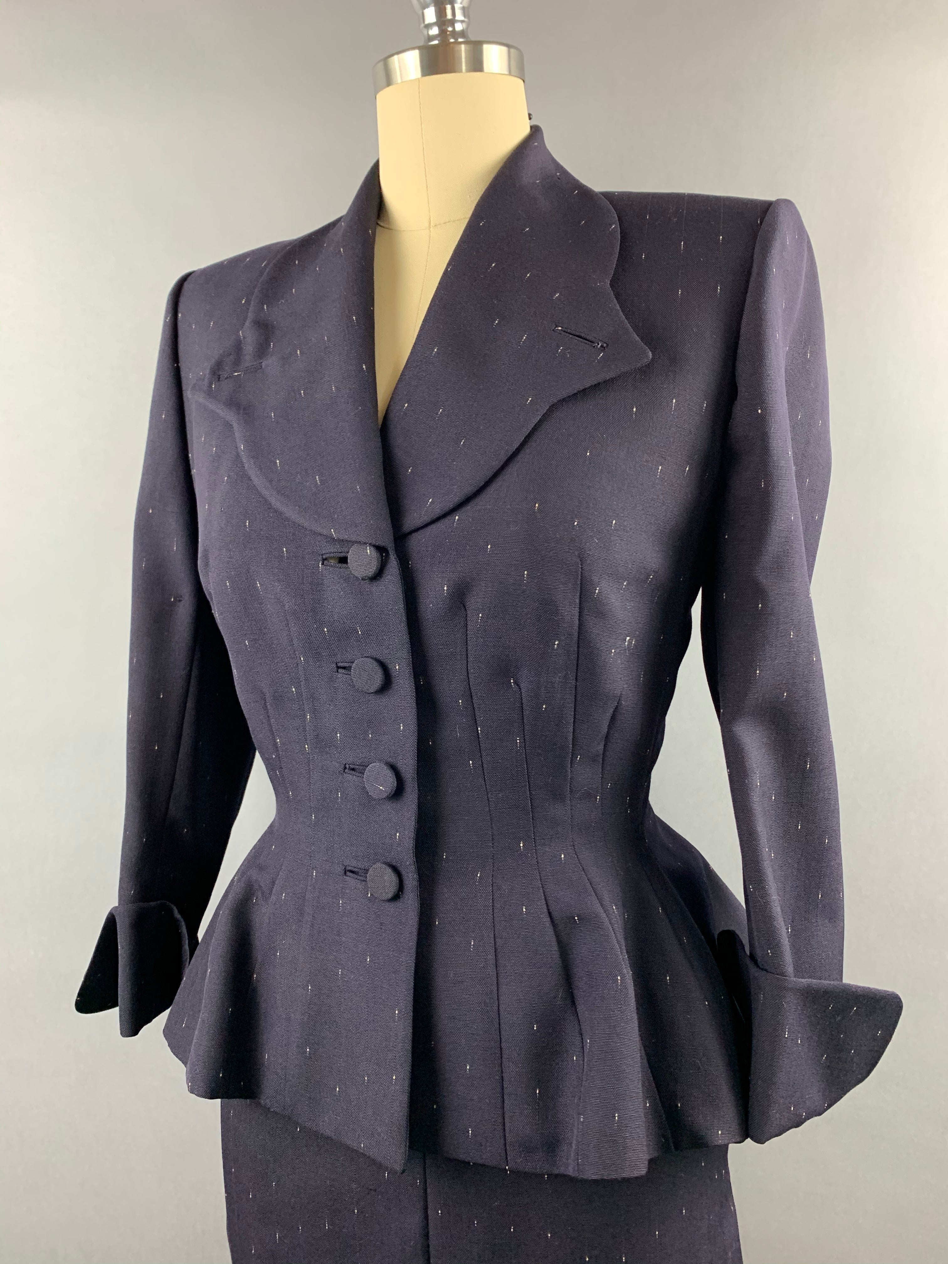 Late 1940s early 1950s Navy Blue with White Fleck Lilli Ann Peplum Suit Size M