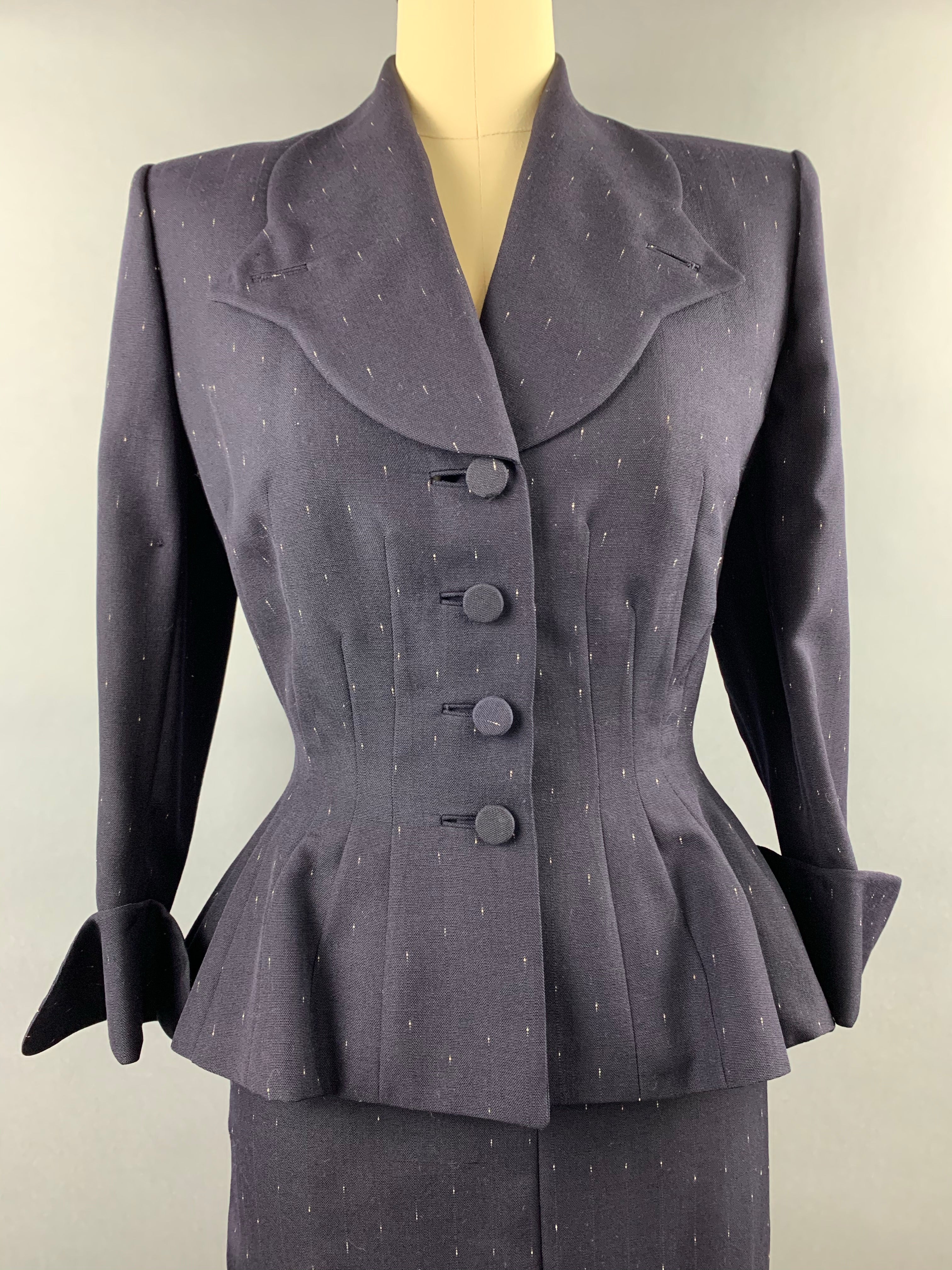 Late 1940s early 1950s Navy Blue with White Fleck Lilli Ann Peplum Suit Size M