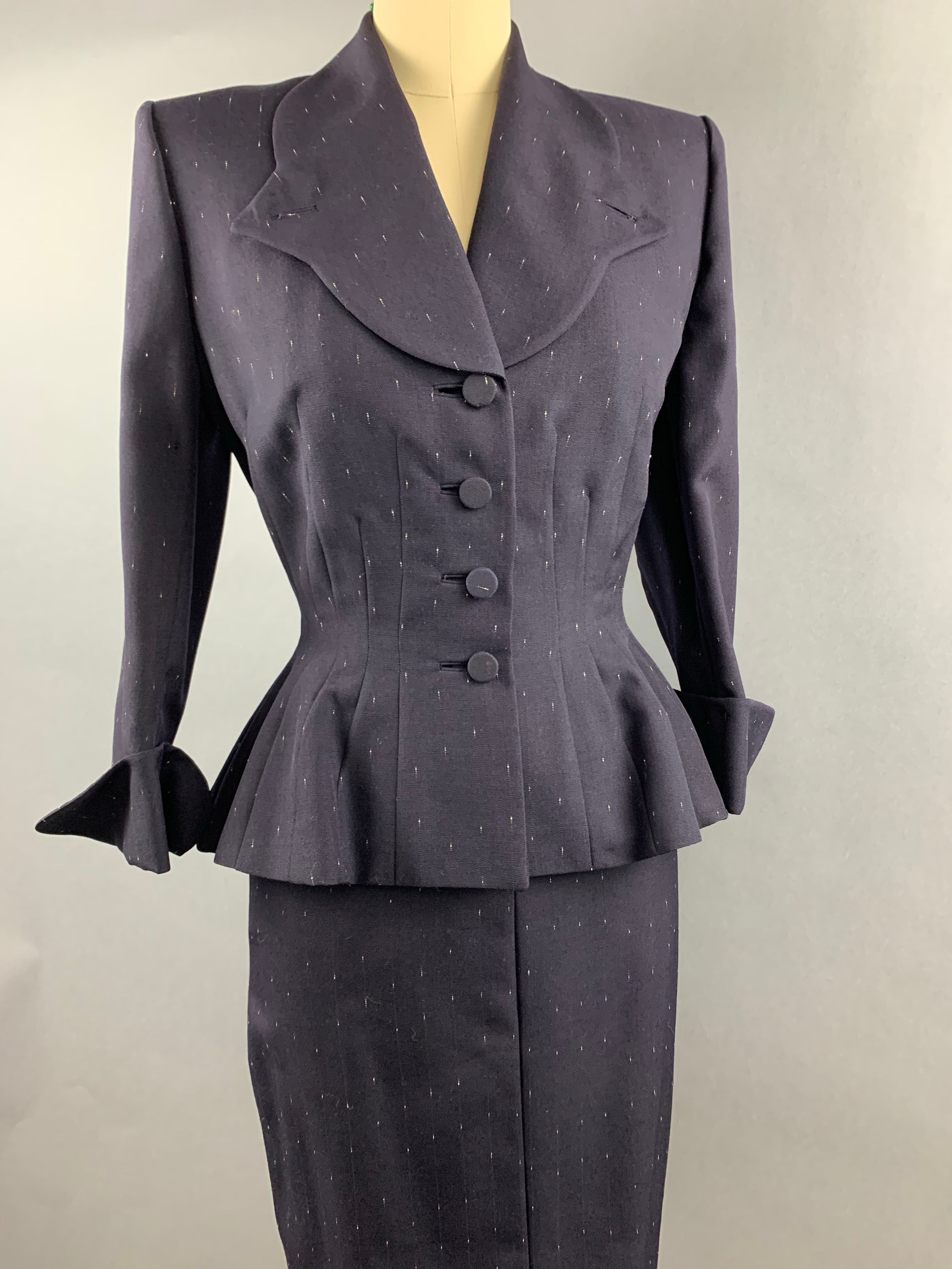 Late 1940s early 1950s Navy Blue with White Fleck Lilli Ann Peplum Suit Size M