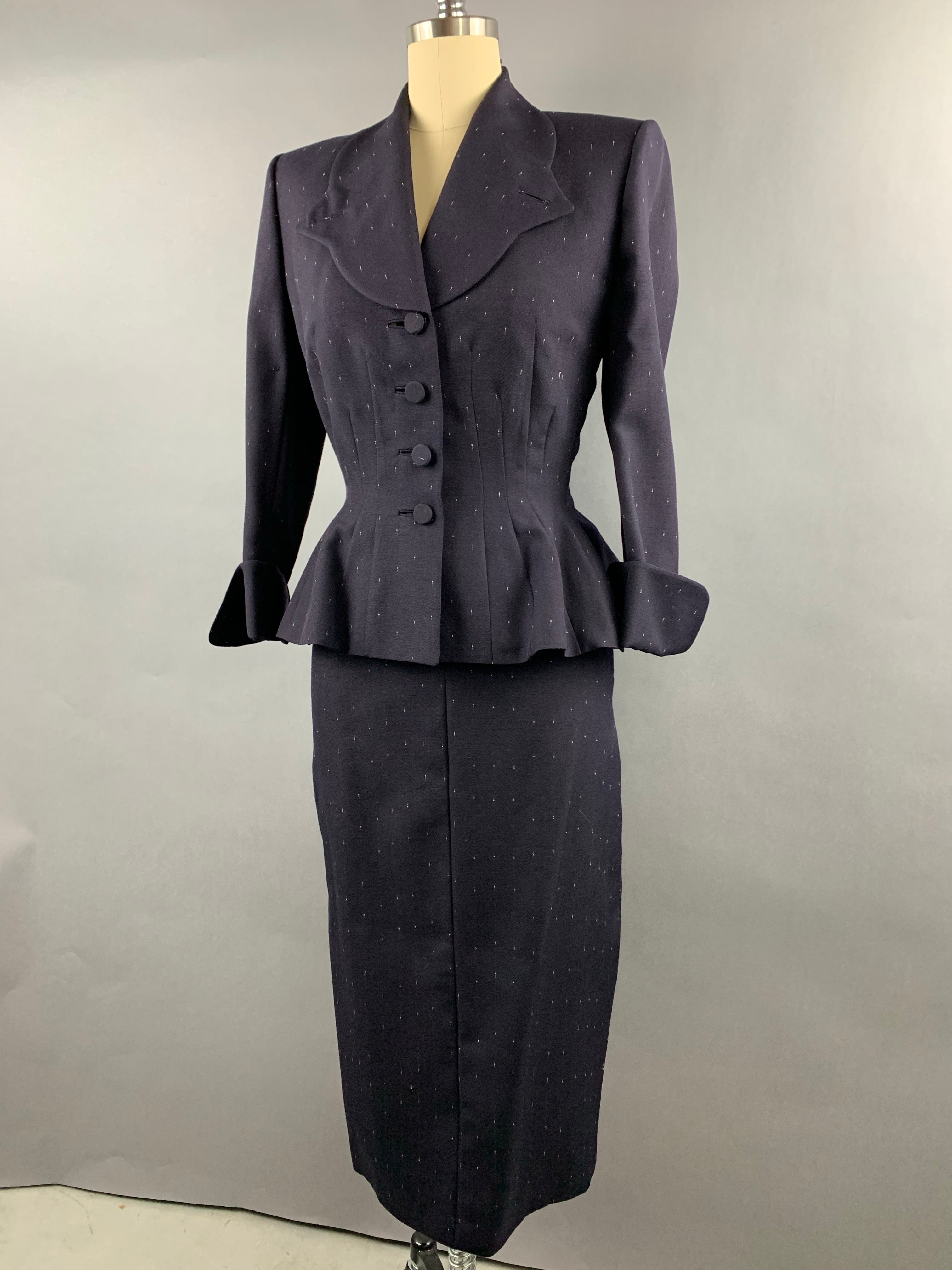 Late 1940s early 1950s Navy Blue with White Fleck Lilli Ann Peplum Suit Size M