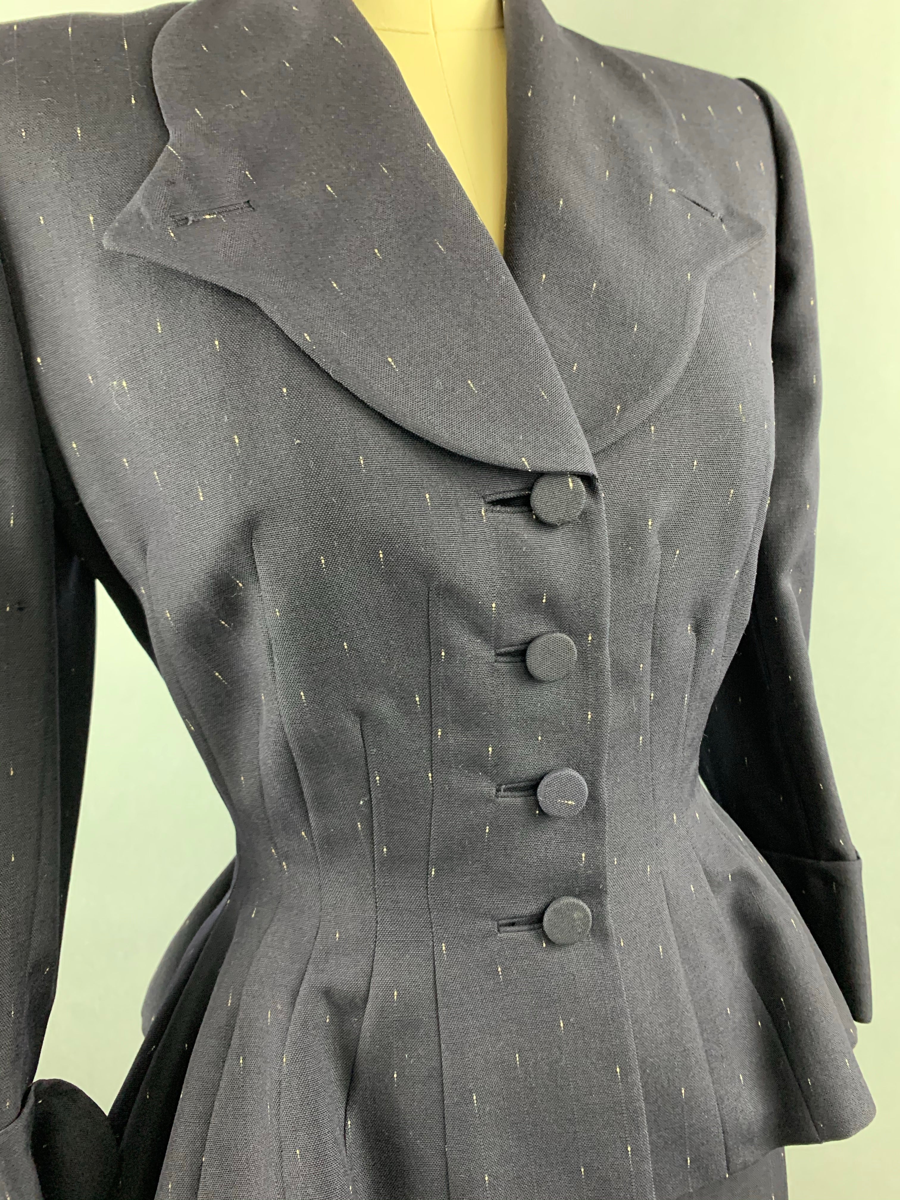 Late 1940s early 1950s Navy Blue with White Fleck Lilli Ann Peplum Suit Size M