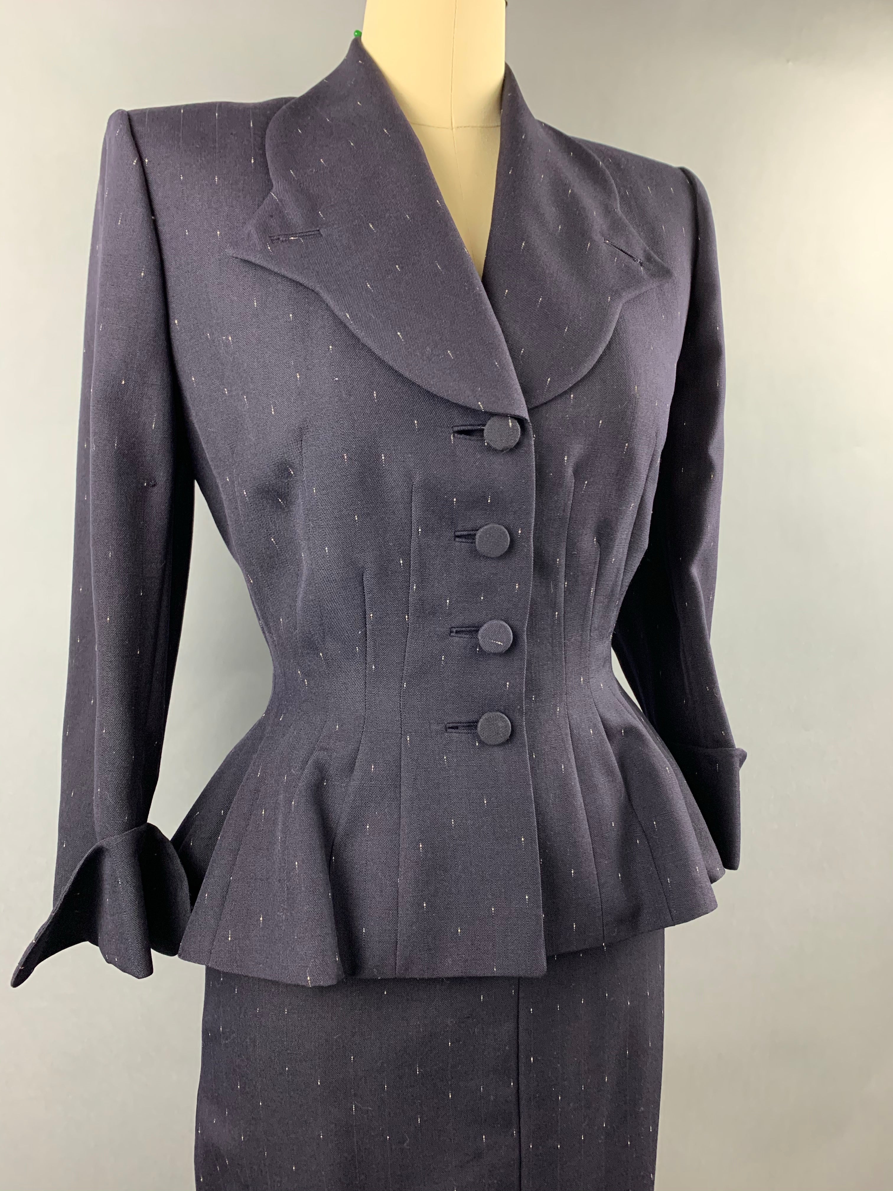 Late 1940s early 1950s Navy Blue with White Fleck Lilli Ann Peplum Suit Size M