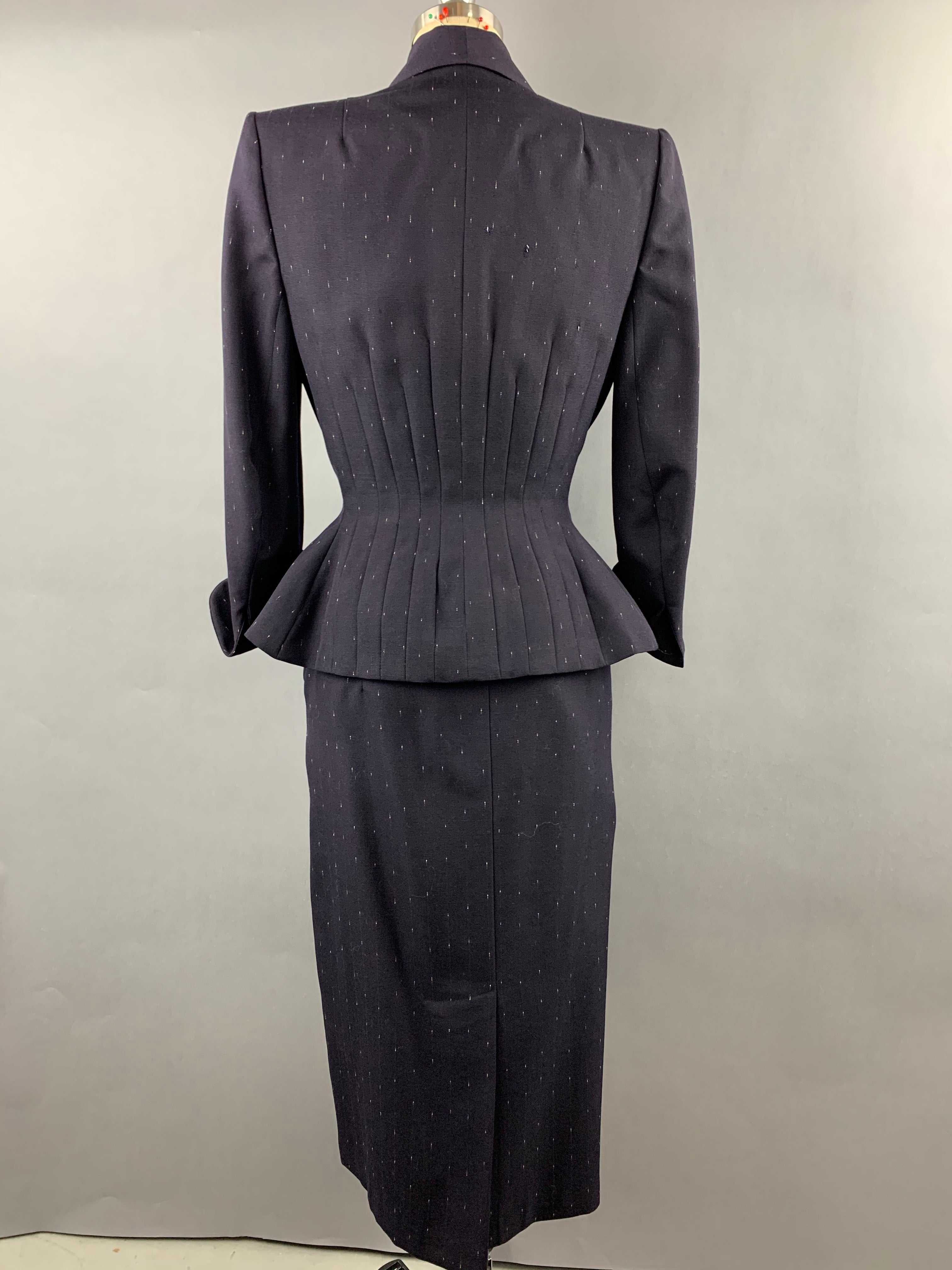 Late 1940s early 1950s Navy Blue with White Fleck Lilli Ann Peplum Suit Size M