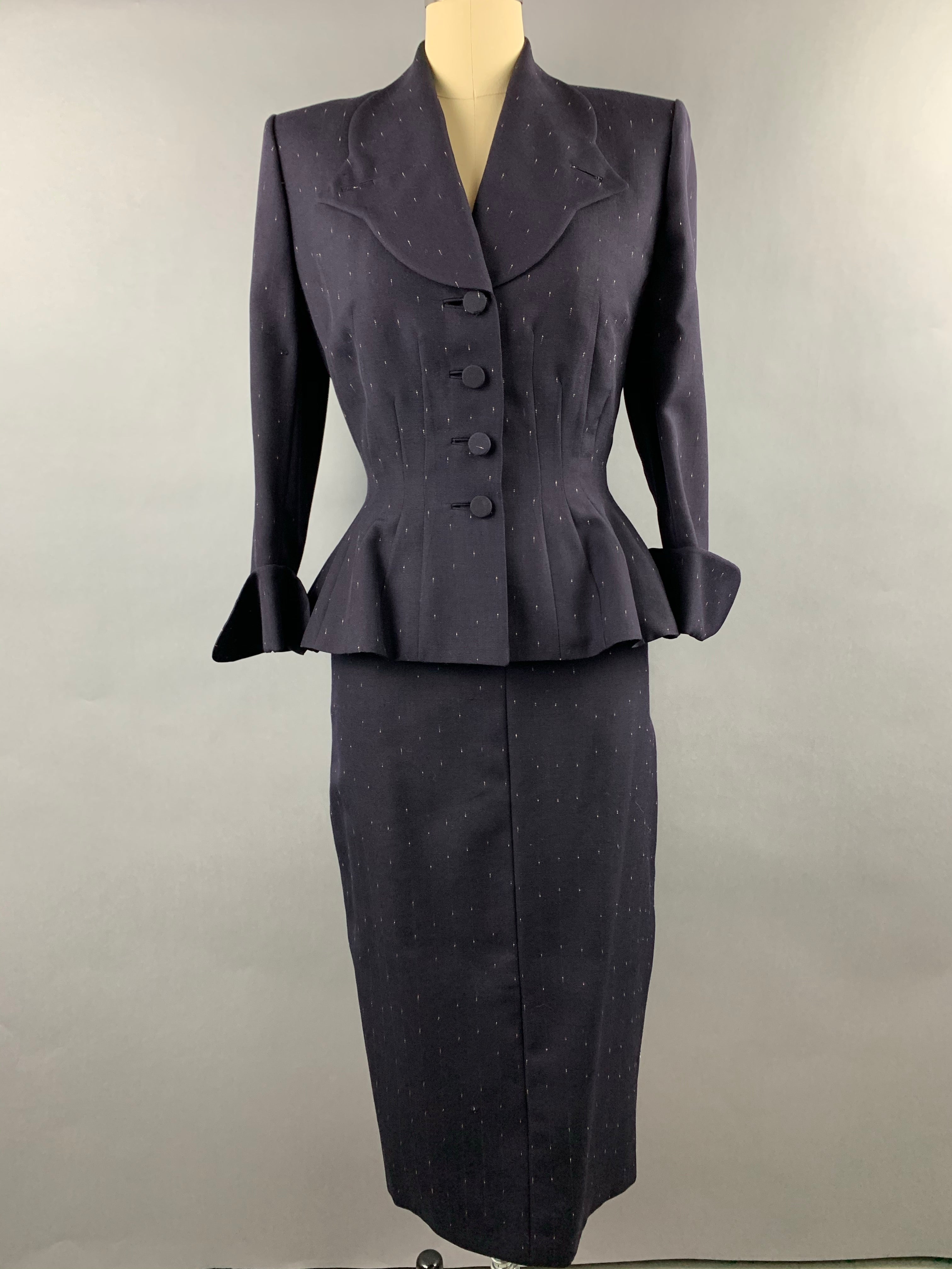 Late 1940s early 1950s Navy Blue with White Fleck Lilli Ann Peplum Suit Size M