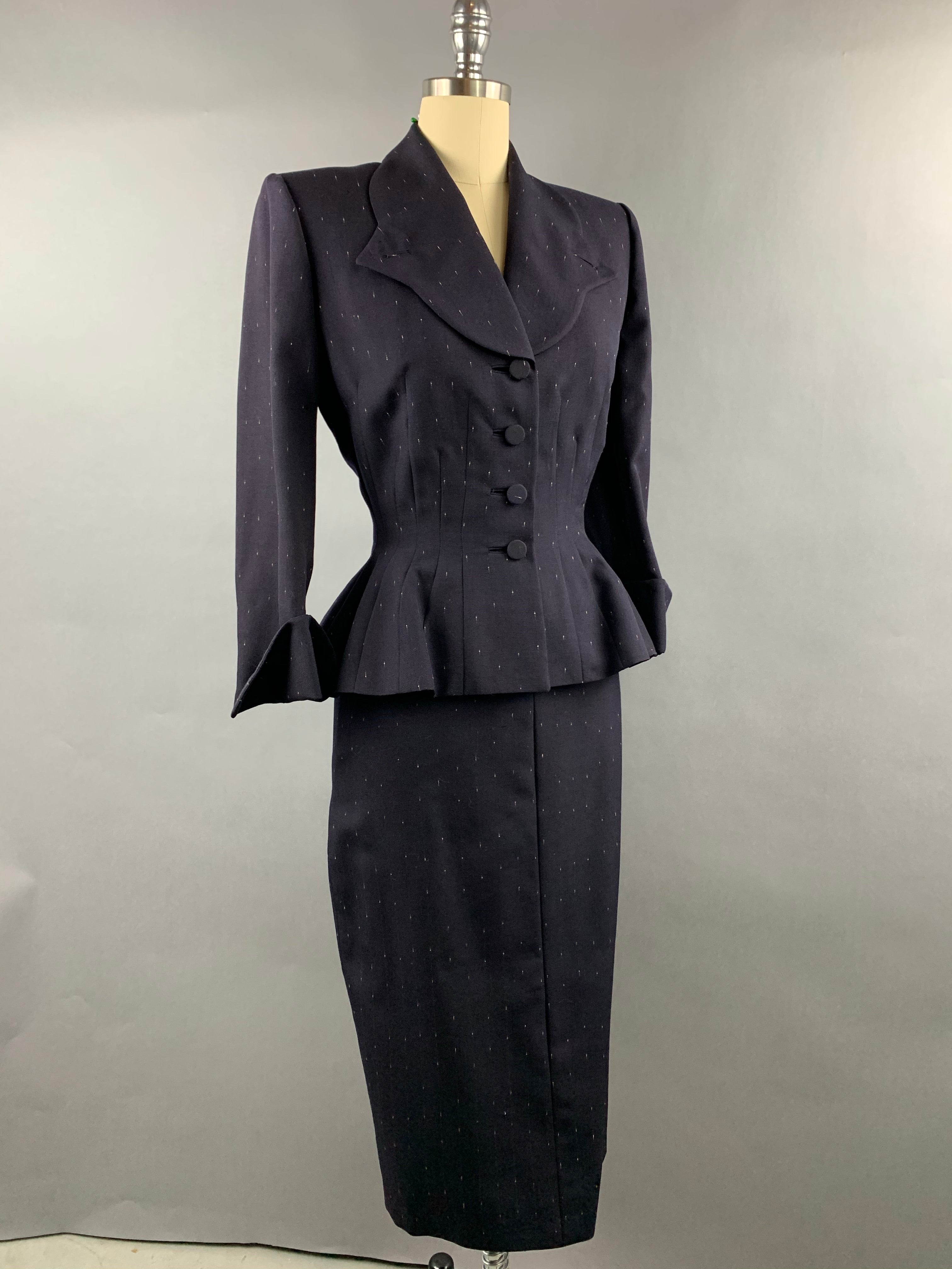 Late 1940s early 1950s Navy Blue with White Fleck Lilli Ann Peplum Suit Size M