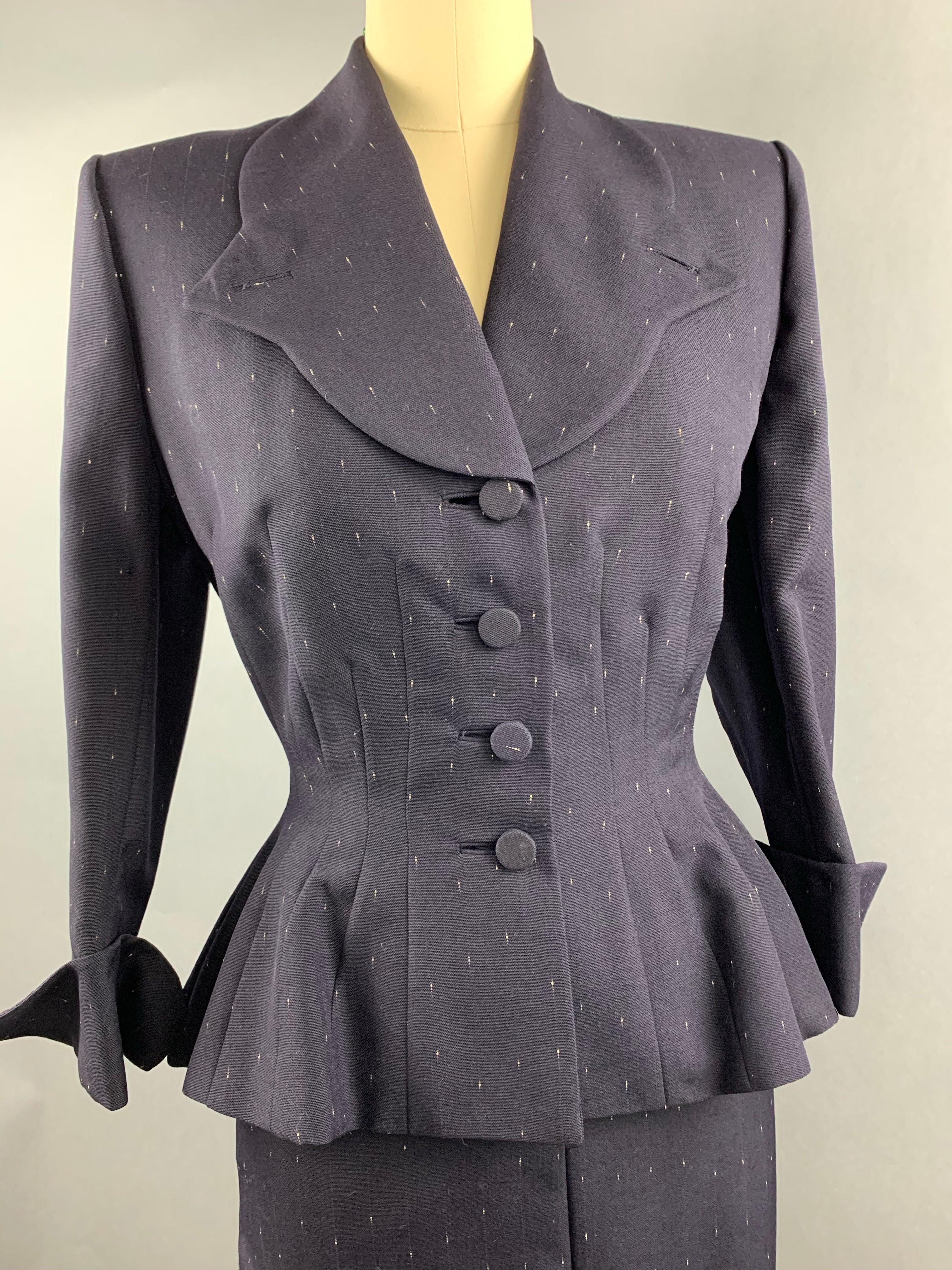 Late 1940s early 1950s Navy Blue with White Fleck Lilli Ann Peplum Suit Size M