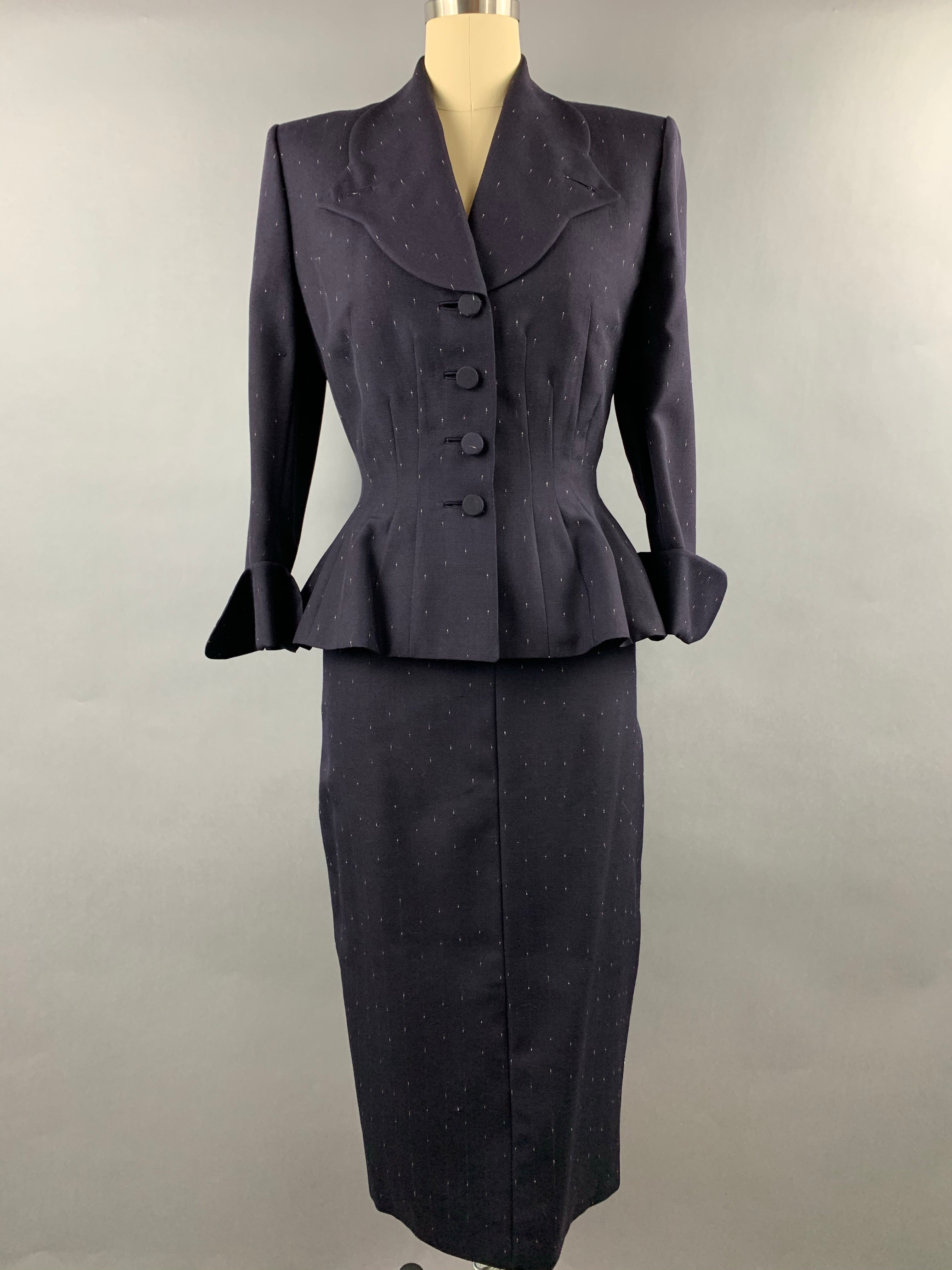 Late 1940s early 1950s Navy Blue with White Fleck Lilli Ann Peplum Suit Size M