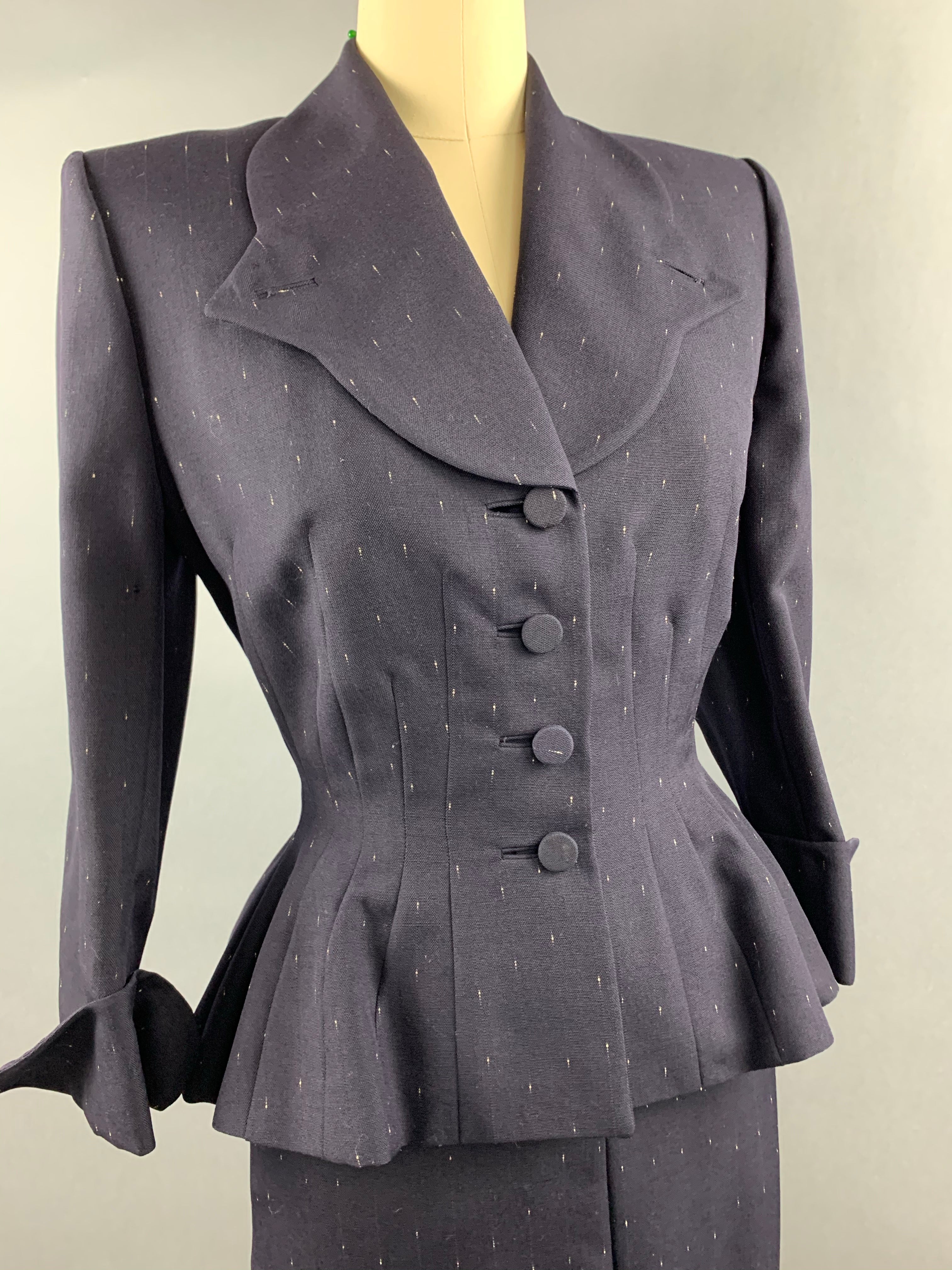 Late 1940s early 1950s Navy Blue with White Fleck Lilli Ann Peplum Suit Size M