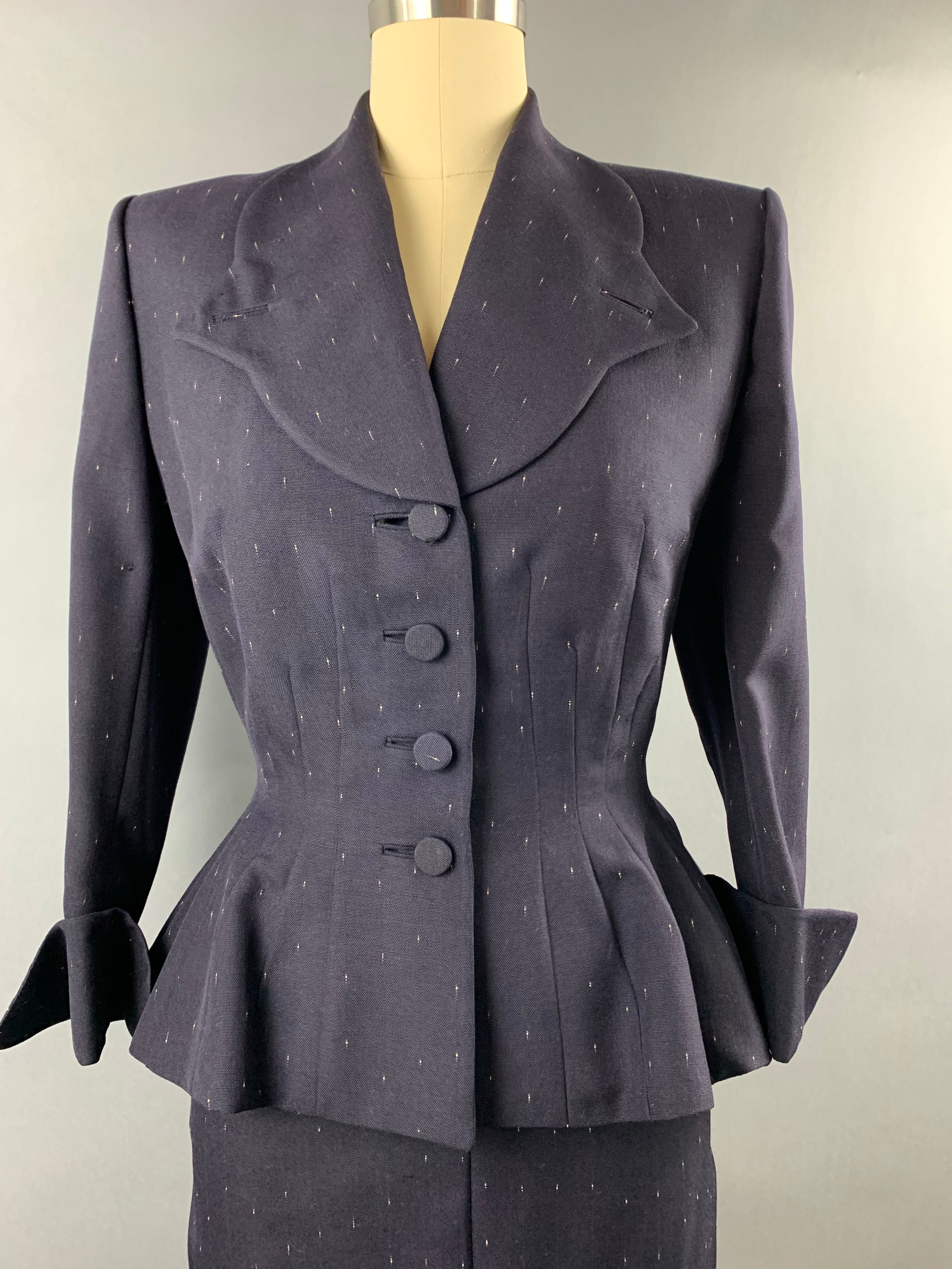 Late 1940s early 1950s Navy Blue with White Fleck Lilli Ann Peplum Suit Size M