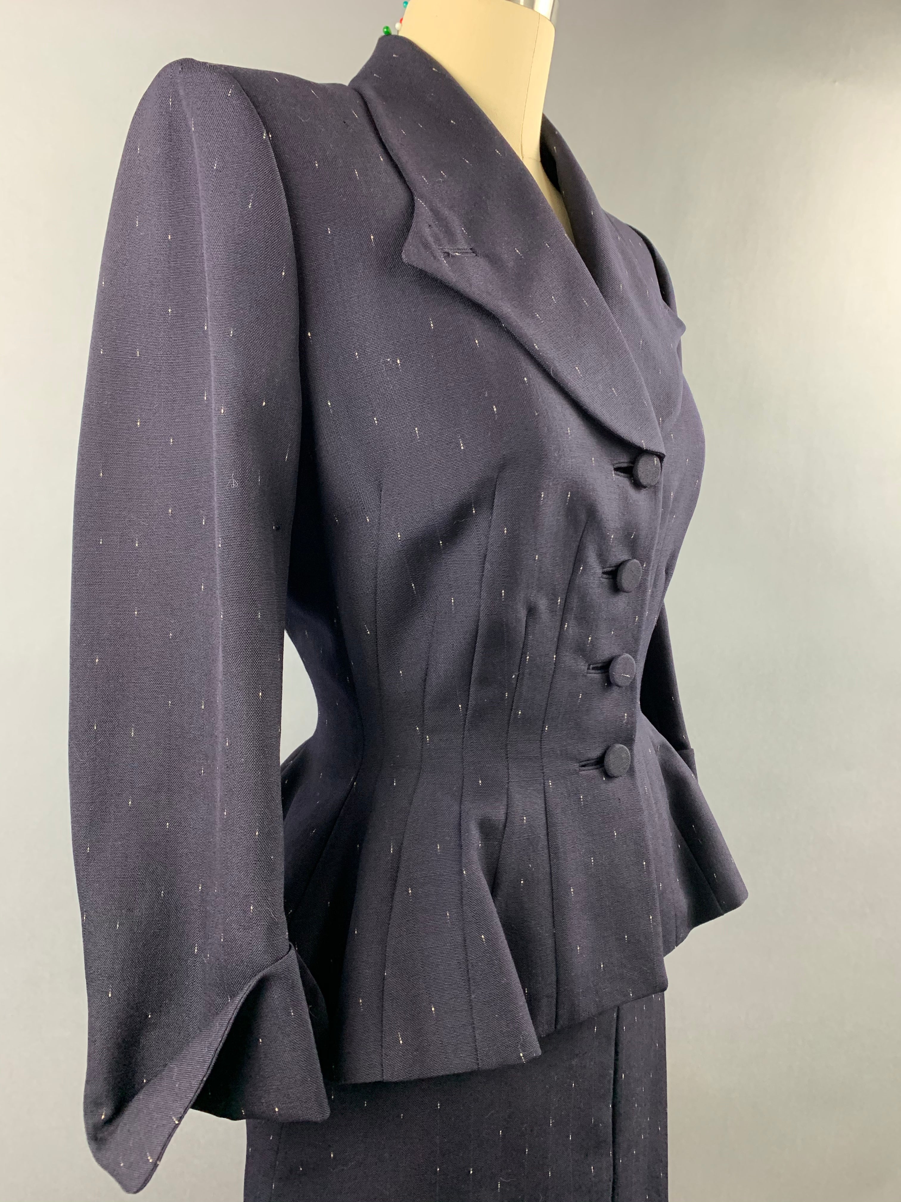 Late 1940s early 1950s Navy Blue with White Fleck Lilli Ann Peplum Suit Size M